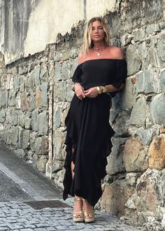 Indulge in the chic style of the Lucy Dress, featuring an off-the-shoulder design, delicate ruffled sleeves, and side seams with romantic ruffles. Modern side openings and a flowing maxi length complete the look. The double-layered body and single layered sleeves create a tantalizing contrast. Elevate your ensemble by pairing it with our Signature belts Elastic on Sleeve 100% Chiffon Lining 100% Chiffon Dry clean or Hand Wash or Delicate Cycle Wash and Hang Dry Designed with love in Miami, FL US Evening Ruffled Maxi Dress, Evening Maxi Dress With Ruffled Skirt, Chic Flowy Off-shoulder Beach Dress, One-shoulder Ruffled Maxi Dress For Cocktails, One Shoulder Ruffled Maxi Dress For Cocktail, Chic Floor-length Maxi Dress With Ruffle Hem, Chic Long Ruffle Dress, Chic Chiffon Maxi Dress With Ruffles, Chic Flowy Ruffled Maxi Dress