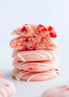 a stack of strawberry shortbread cookies with white icing