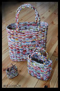 two baskets sitting on top of a wooden floor