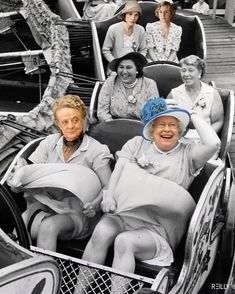 an old black and white photo of some women in roller coasters