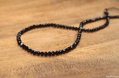 This necklace features shiny and beautiful black spinel faceted rondelles. The stones are strung on high quality beading wire and the necklace closes with a lobster clasp. You can choose a rose gold, sterling silver or gold filled clasp. People have compared black spinel to black diamonds because of their gorgeous shine! black spinel- 5mm (approx.) Please select what length you would like the necklace to be made and if you would like a rose gold, gold filled or sterling silver clasp. You can cho Black Rondelle Spacer Beads Jewelry, Black Rondelle Gemstone Beaded Necklace, Black Rondelle Gemstone Beaded Jewelry, Black Rondelle Gemstone Beads Jewelry, Black Spinel Jewelry, Black Spinel Necklace, Spinel Necklace, Spinel Jewelry, Black Diamond Necklace