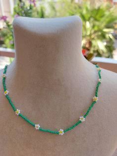 A pretty necklace perfect for everyday wear. So cute and dainty this layering necklace looks lovely on it's own on layered with other necklace. Daisy beaded necklace is an excellent and elegant gift for your lovelies. Choker necklace is made of white and green bead. You can wear the seed bead necklace to a wedding party and look very special. This tiny choker is made of glass beads. Please select necklace length from the drop-down menu or request an arbitrary length. If you would like a bigger/smaller size please contact me. You can press the contact button. Beaded Flower Necklace For Summer Gifts, Summer Beaded Necklaces With Flower Charm As Gift, Summer Flower Shaped Beaded Necklace With Tiny Beads, Summer Flower Beaded Necklaces, Summer Gift Beaded Necklace With Flower Charm, Summer Flower-shaped Beaded Necklace With Tiny Beads, Summer Floral Beaded Chain Necklace, Summer Flower Necklace With Tiny Beads, Summer Flower Necklace With Tiny Round Beads