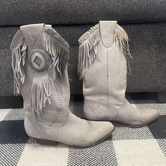 "^ Light Gray/Taupe-ish Fringe & Concho Cowgirl Boots with Wooden Heel. Size: Women's Size 7M Size Label Vintage: 7M Content: Genuine Leather and Manmade other parts Label: Circle S \"Tonka\" ^ Please note specific garment measurements below: Bottom of Sole Length: 10\" Height: 13\" from floor to top  Heel Height: 1.5\" * condition * Fair Condition - These have stains and the fringe is discolored making it darker in places. please note the condition is listed as fair because I do not accept retu Bohemian Mid-calf Boots With Round Toe For Fall, Western Style Fringe Boots For Spring, Bohemian Winter Boots With Snip Toe, Bohemian Snip Toe Winter Boots, Bohemian Rodeo Boots For Fall, Bohemian Boots For Rodeo In Fall, Bohemian Winter Snip Toe Boots, Bohemian Rodeo Fall Boots, Bohemian Fall Rodeo Boots