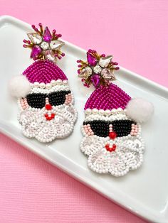 Unwrap the magic of the season with our Beaded Christmas Pink Santa Earrings - the perfect holiday accessory that effortlessly transitions from Secret Santa surprises to delightful stocking stuffers, making them the ideal Christmas gift or fun addition to any White Elephant exchange. Handcrafted with meticulous care, these earrings feature a charming pink Santa design adorned with a festive palette of red, green, and gold beads. Whether you're searching for a thoughtful Secret Santa gift, a fest Santa Earrings, Pink Santa, Holiday Earrings, Secret Santa Gift, Earrings Christmas, Holiday Earring, Christmas Earrings, White Elephant, Secret Santa Gifts