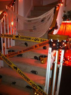 halloween decorations on the stairs with caution tape