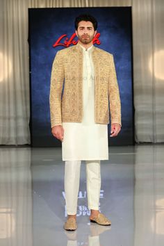 Check out the fully embroidered and hand embellished open front golden prince coat, paired with kurta pajama and shoes. Our stunning ensemble on display at the London Lifestyle Show on 17-18 June 2023. Luxury Single Breasted Nehru Jacket For Winter, Gold Embroidered Straight Kurta Bandhgala, Designer Bandhgala With Gold Embroidery Straight Kurta, Bollywood Style Gold Sherwani With Straight Kurta, Gold Bollywood Sherwani With Straight Kurta, Designer Nehru Jacket With Gold Embroidery For Eid, Gold Sherwani With Dabka Work Straight Kurta, Gold Embroidered Bandhgala Straight Kurta, Gold Embroidered Bollywood Nehru Jacket