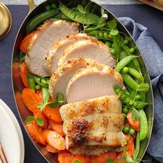 a pan filled with meat and vegetables on top of a table