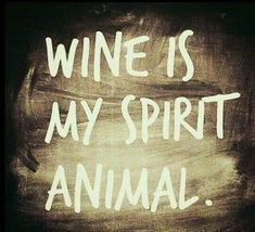 the words wine is my spirit animal written in chalk on a blackboard with white writing