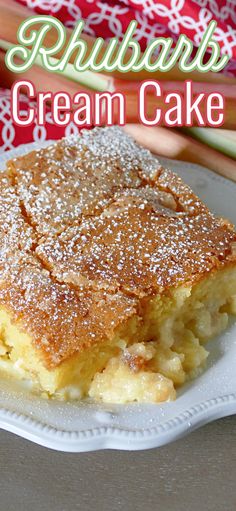 a close up of a plate of food on a table with rhubarb creme cake