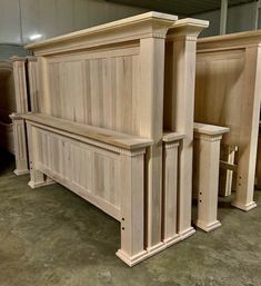 two wooden benches sitting next to each other in a room with concrete floors and walls