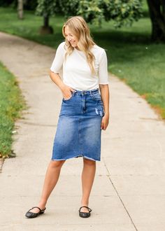 The Tiana Distressed Denim Midi Skirt is a modest and cute denim midi skirt! Designed with backed distressing at the front and back pockets, an uneven raw hem, 5 pockets for holding all the things, and a classic button zipper closure. Style: distressed, denim, midi length Color: Denim Quality control is of the utmost importance to us. Our sizing is always approximate and can also depend heavily on your own body shape. Just like no two people are the same, the same goes for skirts, dresses + tops Modest Shirt, Glamorous Fashion, Denim Midi Skirt, Body Shape, Top Dress, Quality Control, Distressed Denim, The Things, Body Shapes