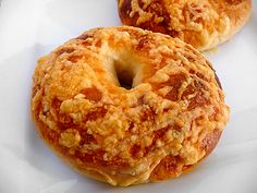 two doughnuts sitting on top of a white plate