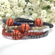 "✦Handmade item ✦Material: gemstone and plastic basketball bead ✦Shape: Round ✦Bead size: 4mm ✦Bracelet length: 7.5\" ( Fit with 6.75\" wrist size) ✦QTY: 1 pcs / package ✦✦Please measure your wrist size, then order the bracelet. MEASURE YOUR WRIST:    - Measure around at the wrist bone in tape or even a strip of paper.   - Choose a place where you would normally wear a bracelet.  Make it as loose or snug.   - To use the strip of paper, mark where the end of the bracelet needs to be and then measure the paper with a ruler.   - Increase the wrist measurement in the following increments to determine the bracelet size for how you want the bracelet to fit.      Add about 1/4 to 1/2 inch for a loose fit. Show your support for your child/friend at their next game! These bracelets make wonderful g Stocking Stuffers For Girls, Bracelet For Girls, Sports Bracelet, Moms Bracelet, Boys Basketball, Basketball Mom, Perfect Stocking Stuffers, Stretchy Bracelets, Coral Beads