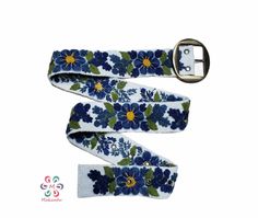 Belts are inspired by the flowers of the Peruvian Andes. Handmade embroidered by women from Ayacucho - Peru The strap is handwoven in wood looms and carefully hand-embroidered with colors that try to replicate the beauty of real flowers we see around us. We decided to be eco-friendly, so we use 100% sheep wool. Material: 100% sheep wool. Design: artistic floral. Width: 5 cm / 2''. It has 7 holes separated by 1'' / 2.5 cm from each other. The first hole is at 2'' / 5 cm from the end It will fit p Bohemian Embroidered Belt For Spring, Handmade Bohemian Belts As Gift, Handmade Bohemian Belt With Multicolor Embroidery, Handmade Artisan Belts For Gifts, Handmade Artisan Belt As Gift, Handmade Adjustable Belts For Gifts, Handmade Adjustable Belts As A Gift, Adjustable Folk Embroidered Belt, Folk Style Adjustable Embroidered Belt