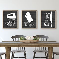 three black and white prints on the wall above a dining room table