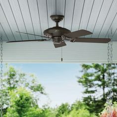 a ceiling fan is hanging from a porch