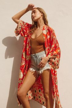 Discover the ultimate in comfort and style with our Sahara Kimono. Featuring a stunning paisley border print, this long duster adds an elegant touch to any outfit. The open front, side pockets, and side splits make it both functional and fashionable. Lightweight and fun, it's the perfect addition to your wardrobe. Floral Print Outerwear For Beach In Fall, Summer Boho Print Long Sleeve Outerwear, Summer Long Sleeve Outerwear With Boho Print, Floral Print Outerwear For Fall Beach Outing, Summer Long Sleeve Boho Print Outerwear, Fall Floral Print Beach Outerwear, Casual Spring Paisley Print Kimono, Spring Beach Outerwear With Boho Print, Boho Print Beach Outerwear For Fall