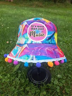 Its more than music bucket hat! Perfect for a show or festival! with or without the trim. Headbanger approved! Size: Medium *Each item is handmade and made-to-order so there may be slight varients between each hat in terms of pattern position, charm position, pompoms, etc. Fun Carnival Costume Hats And Headpieces, Fun Snapback Hats For Festivals, Fun Wide Brim Hat For Music Festival, Adjustable Multicolor Hat For Music Festival, Multicolor One Size Hats For Music Festival, Fun Festival Costume Hats And Headpieces, Fun Cotton Festival Hats, Fun Snapback Hats For Music Festival, Fun Festival Bucket Hat With Curved Brim