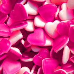 red and white heart shaped candies in a bowl