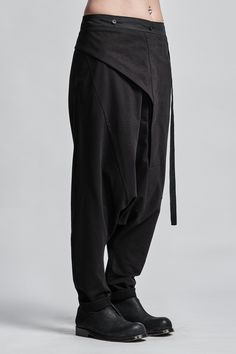 "Drop Crotch Trouser with Asymmetrical Front Closure__ // EXPRESS DELIVERY ONLY __Elastic Backside Waistband with Belt __2 Front Pockets __1 Back Bonded Pockets __Asymmetrical Hidden Front Closure __Soft Cotton Fabric model__ bust 92 (36\"), waist 72 (28\"), hips 102 (40\"), biceps 28 (11''), height 177 (5'8\"), kg 65 (143 lbs) model wears size M | color: black fabric__ 100 cotton care__ delicate machine wash at 30 c wash inside out use cool iron do not tumble dry sizing__ size XS (US 4, EU 34, Workwear Bottoms With Belt Loops And Asymmetrical Hem, Asymmetrical Hem Bottoms With Belt Loops For Work, Fitted Black Bottoms With Irregular Shape, Fitted Irregular Black Bottoms, Black Pants With Asymmetrical Hem For Work, Black Asymmetrical Hem Pants For Work, Black Asymmetrical Hem Workwear Pants, Black Baggy Asymmetrical Bottoms, Black Asymmetrical Baggy Bottoms