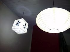 two lamps hanging from the ceiling in a room