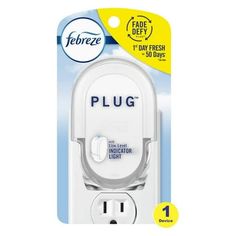 a white plug with the word plug on it in front of a packaging for an electric outlet