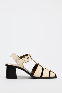 LEATHER CAGE SANDALS - White | ZARA United States Modern T-strap Sandals With Buckle For Spring, Spring T-strap Sandals With Tang Buckle, Modern Spring Heels With Tang Buckle, Modern T-strap Heels For Summer, Zara Block Heel Sandals With Heel Strap, Zara Sandals With Block Heel And Heel Strap, Zara Sandals With Heel Strap And Block Heel, Spring Sandals With Block Heel And Tang Buckle, Spring Block Heel Sandals With Tang Buckle