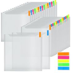 a bunch of white folders with colored labels on them