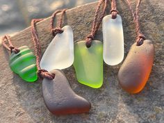 Sea glass necklaces. Reclaimed from the ocean, drilled and made into something new and beautiful. An eco friendly gift for yourself or a loved one.  I have hung them on sustainable hemp. The cord has been left loose so you can tie at your preferred length.  The pendant will arrive in a smart recycled gift box.  If purchasing as a present, recycled handmade cards are also available in my shop. I would be happy to add a message of your choice if you wish me to post direct.  Lynda - EcoOctopus 💚 h Unique Recycled Glass Necklaces For Beach, Unique Recycled Glass Beach Necklace, Unique Handmade Sea Glass Necklaces, Handmade Bohemian Sea Glass Necklaces, Handmade Unique Necklace With Sea Glass, Handmade Bohemian Sea Glass Necklace, Minimalist Recycled Glass Necklaces For Gifts, Minimalist Handmade Necklaces With Recycled Glass, Minimalist Handmade Necklace With Recycled Glass