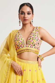 Yellow padded blouse featuring multi-color floral thread and embroidery with tassel detailing on the waistline. Paired with a can-can attached, sequin hand embroidered lehenga with pockets. Comes with a sheer embroidered dupatta. - Aza Fashions Lehenga Pattern, Yellow Lehenga, Padded Blouse, Embroidered Lehenga, Backless Blouse, Embroidered Dupatta, Can Can, Set For Women, Aza Fashion