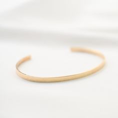 "14K gold cuff bracelet. 14K Gold Minimalist Cuff Bracelet * 14K solid gold. It is about 3mm x 1mm Please select the size of your wrist. If your wrist is 6\", please purchase 6\" bracelet. (If you order a 6\" bracelet, actual cuff length will be 5\" plus 1 inch opening.) Please read our policies before you place your order. https://www.etsy.com/shop/SashJewelry/policy?ref=shopinfo_policies_leftnav To see other Mother daughter necklace set click here: https://www.etsy.com/shop/SashJewelry?section Adjustable Matte Gold Minimalist Bracelet, Minimalist Rose Gold Bracelet With Polished Finish, Minimalist Polished Rose Gold Bracelet, Modern 14k Gold Cuff Bracelet For Everyday, Minimalist Yellow Gold Cuff Bracelet For Formal Occasions, Minimalist Polished Cuff Bracelet For Wedding, Adjustable Minimalist Gold Bracelet With Polished Finish, 14k Gold Polished Minimalist Cuff Bracelet, Minimalist 14k Gold Cuff Bracelet With Polished Finish