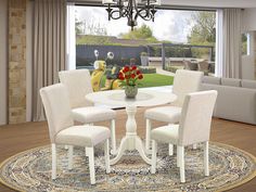 a dining room table with four chairs and a rug in front of a large window