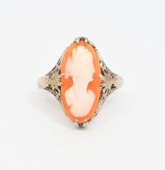 Gorgeous vintage cameo ring claw-set in solid 14k white gold filigree. Detail extends down the shoulders. Stunning!N-S Face measurement, including frame: 18 mmSize 5 - 5.25 Band falls at just over 5.25, but with the long face, it will likely "fit" slightly smallerVery good condition. Light wear.Includes featured ring only. We have lots more beautiful cameos (pins, necklaces, and earrings) available in our store... https://www.etsy.com/shop/MyMenagerieVintage💙We are pleased to say that we purcha Art Deco Carved Round Jewelry, Elegant Carved White Gold Rings, Formal White Gold Carved Jewelry, Art Deco Cameo Ring For Collectors, Art Deco Cameo Ring Collectible, Art Deco Carved Rings For Wedding, Vintage Carved White Gold Jewelry, Art Deco Cameo Collectible Rings, Fine Jewelry Cameo Wedding Ring