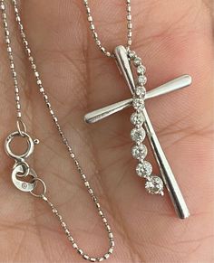 "Stunning 10k White Gold Diamond Cross 14k Barrel Link Chain 17\" Necklace! It is in beautiful pre-owned condition! Perfect for a gift! * The gorgeous diamond cross pendant measures approximately 1 1/8\" high x 3/4\" wide. * Eleven (11) bright white natural round diamonds set into the solid 10k white gold cross, in a graduated swirl pattern. * Approximately .30 CTW * Comes included with a solid 14k white gold 17\" barrel link chain! * 3 Grams total weight. Please message me with any questions. Shipped FAST and FREE, fully insured and in a gift box. I guarantee item to be exactly as described and pictured." Diamond White Cross Pendant Necklace With Prong Setting, Gift-ready Brilliant Cut White Gold Cross Necklace, Gift Cross-shaped Diamond Necklace With Prong Setting, Nickel-free White Gold Cross Pendant Jewelry, White Diamond-cut Pendant Cross Necklace, Eleven 11, Round Diamond Setting, Diamond Cross Pendants, Coin Ring