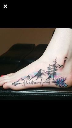 a person with a tattoo on their foot that says adventure awaits and an arrow