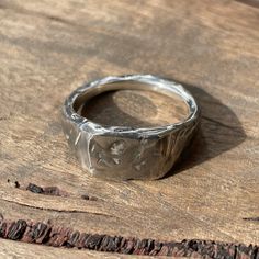 This beautifully textured, rugged version of our Small Square Signet Ring is ready for anything life throws at it. It's hip to be square... These timeless signet rings are meticulously crafted by hand in our Melbourne workshop, created out of wax and then cast into precious metal. Made with the highest quality Australian sterling silver to last forever. Made solid, not hollow like many others, all of our rings are hand-stamped with a Sterling Silver (925) hallmark and Custom Creed makers mark an Unique Signet Ring For Promise With Lost Wax Casting, Untreated Sterling Silver Rings With Rustic Style, Rustic Untreated Ring As A Gift, Rustic Untreated Ring For Gift, Rustic Untreated Rings For Gift, Minimalist Hand Cast Signet Ring For Gift, Minimalist Hand Cast Signet Ring Gift, Rustic Silver Untreated Rings, Rustic Untreated Silver Ring