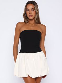 Features: Explore your feminine side with the Joan Ruffled Contrast Slin Mini Dress. This fashion-forward dress features a high waist and patchwork design, perfect for showing off your curves. The strapless and backless design adds a touch of sexiness to your summer wardrobe. Stand out and make a statement with this new must-have dress. Chic White Backless Tube Top, Chic White Tube Top For Date Night, Fitted Black Strapless Dress For Day Out, Black Fitted Strapless Dress For Day Out, Chic Backless Tube Top For Summer, Chic White Stretch Strapless Dress, Chic White Bandeau Strapless Dress, Chic Strapless Bandeau Dress For Brunch, Elegant Black Tube Top For Day Out