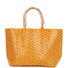 This St. Louis PM tote is of yellow Goyardine canvas with palladium hardware, contrast stitching, and has a matching detachable button closure wallet The interior is lined with white canvas.Origin: FranceCondition: New and never worn Accompanied by: Dustbag and felt Measurements: 13.3" x 11" x 6"; 7" shoulder strap Yellow Travel Shoulder Bag With Palladium Hardware, Yellow Coated Canvas Shoulder Bag For Travel, Yellow Coated Canvas Bags For Travel, Designer Shoulder Bag With Leather Handles In Yellow, Monogram Canvas Tote Bag With Palladium Hardware, Luxury Yellow Shoulder Bag For Everyday, Yellow Coated Canvas Bag For Travel, Designer Large Capacity Yellow Bag, Luxury Yellow Bag With Palladium Hardware