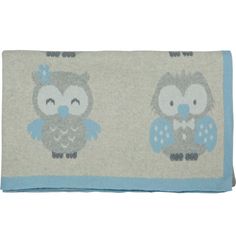 an image of two owls on a blue and beige background with white trimmings