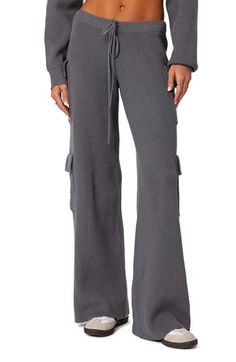 These high-rise sweater-pants feature cargo-style patch pockets and a relaxed profile ideal for off-duty days. Elastic/drawstring waist Cargo flap-patch pockets 50% polyester, 50% rayon Machine wash, dry flat Imported Utility Sweatpants With Multiple Pockets For Loungewear, Utility Cargo Pants For Loungewear, Utility Sweatpants With Pockets For Loungewear, Utility Style Sweatpants For Loungewear, Gray Drawstring Pants For Fall, Full Length Drawstring Pants For Fall, Winter Cargo Pants With Pockets For Loungewear, Winter Utility Cargo Pants With Elastic Waistband, Utility Style Loungewear Pants With Multiple Pockets