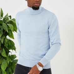 Slip into comfortable designer stylings in this handsome long-sleeved turtleneck with a traditional ribbed cuff design for versatility when paired with casual or semi-formal outfits. Blue Long Sleeve Turtleneck With Ribbed Cuffs, Fitted Blue Sweater With Ribbed Collar, Blue Funnel Neck Top With Ribbed Cuffs, Blue Turtleneck For Winter Layering, Blue Long Sleeve Turtleneck For Fall, Casual Blue Long Sleeve Turtleneck, Blue Ribbed Collar Turtleneck For Winter, Blue Stretch Turtleneck For Fall, Blue Funnel Neck Sweater With Ribbed Cuffs