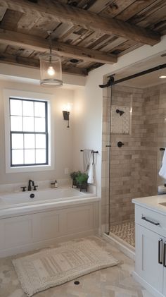 a bathroom with a tub, sink and shower in it's own area is shown