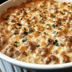 a casserole dish with meatballs and cheese