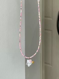 Pink Kitty Necklace Hand Beaded This adorable hand-beaded Pink Kitty Necklace is perfect for any fashion-forward feline lover. With its playful pink design and delicate construction, it's sure to add a touch of cuteness to any outfit. Show off your love for kitties with this charming accessory. Size: 38m-45cm Trendy Pink Beaded Necklaces With Heart Beads, Cute Pink Beaded Chain Jewelry, Cute Handmade Pink Beaded Necklaces, Cute Pink Beaded Jewelry, Trendy Pink Beaded Chain Necklaces, Cute Pink Beaded Chain Necklaces, Cute Pink Necklaces With Tiny Beads, Cute Pink Beaded Necklaces, Cute Pink Beaded Chain Necklace