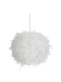 a white feather ball hanging from a string