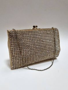 "An absolutely gorgeous, on-of-a-kind vintage crystal embellished evening bag. This beauty features a cream silk lining and a chic short metal chain strap. One claw-set crystal is missing on the bottom left corner, there'e patina to the kiss lock fastening, and there's some light, age-related staining to the silk interior The label inside says, \"made in Englan\".  Approx 16cm x 11.cm x 2cm. The chain strap measures 35cm. Clean and ready to use.  -------------------- 🌟P&P: 👉Will arrive gift wrapped, in a padded envelope. 👉UK shipping: 1st Class Signed For 👉International Shipping: Tracked  -------------------- 💎 FOLLOW US:  👉 www.instagram.com/janedreamsofvintage 👉 www.facebook.com/JaneDreamsOfVintage" Elegant Sparkling Evening Bag For Events, Elegant Sparkling Evening Bag, Sparkling Clutch Evening Bag For Formal Occasions, Chic Sparkling Evening Bag For Formal Occasions, Chic Sparkling Evening Bag For Formal Events, Glamorous Rhinestones Evening Bag For Formal Occasions, Chic Sparkling Evening Bag For Events, Silver Sparkling Bags For Evening, Silver Sparkling Evening Bags