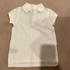 Brand New, Never Worn, Comes With Tags! White With Two Buttons And Collared. Light Pink Logo. 100% Cotton. Ralph Lauren, Girls’ Size 4/4t Cute Fitted Ralph Lauren Tops, Fitted Cute Ralph Lauren Tops, Cute Ralph Lauren Summer Tops, Cute Summer Tops By Ralph Lauren, White Cotton Ralph Lauren Top, White Ralph Lauren Summer Top, Ralph Lauren White Summer Top, White Fitted Ralph Lauren T-shirt, Fitted White Ralph Lauren T-shirt