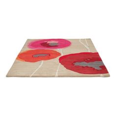 an area rug with different colored flowers on it