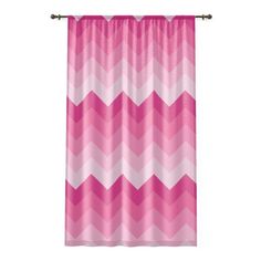 pink and white chevroned curtains hanging on a curtain rod with metal hardwares