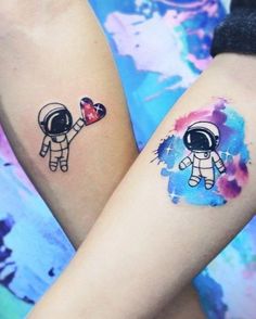 two people with matching tattoos on their arms